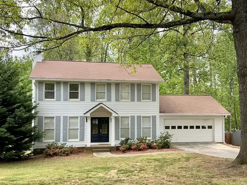 Small, white mid-class home
