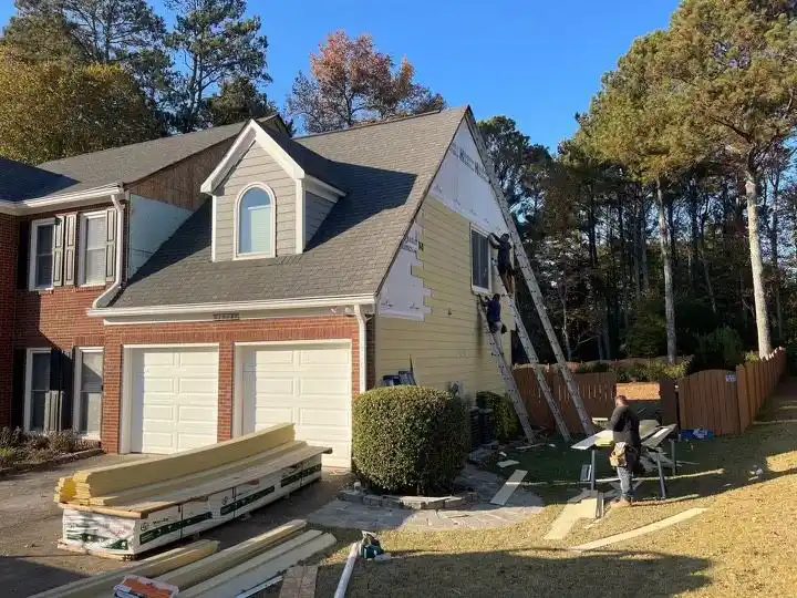 Yellow siding installation on home